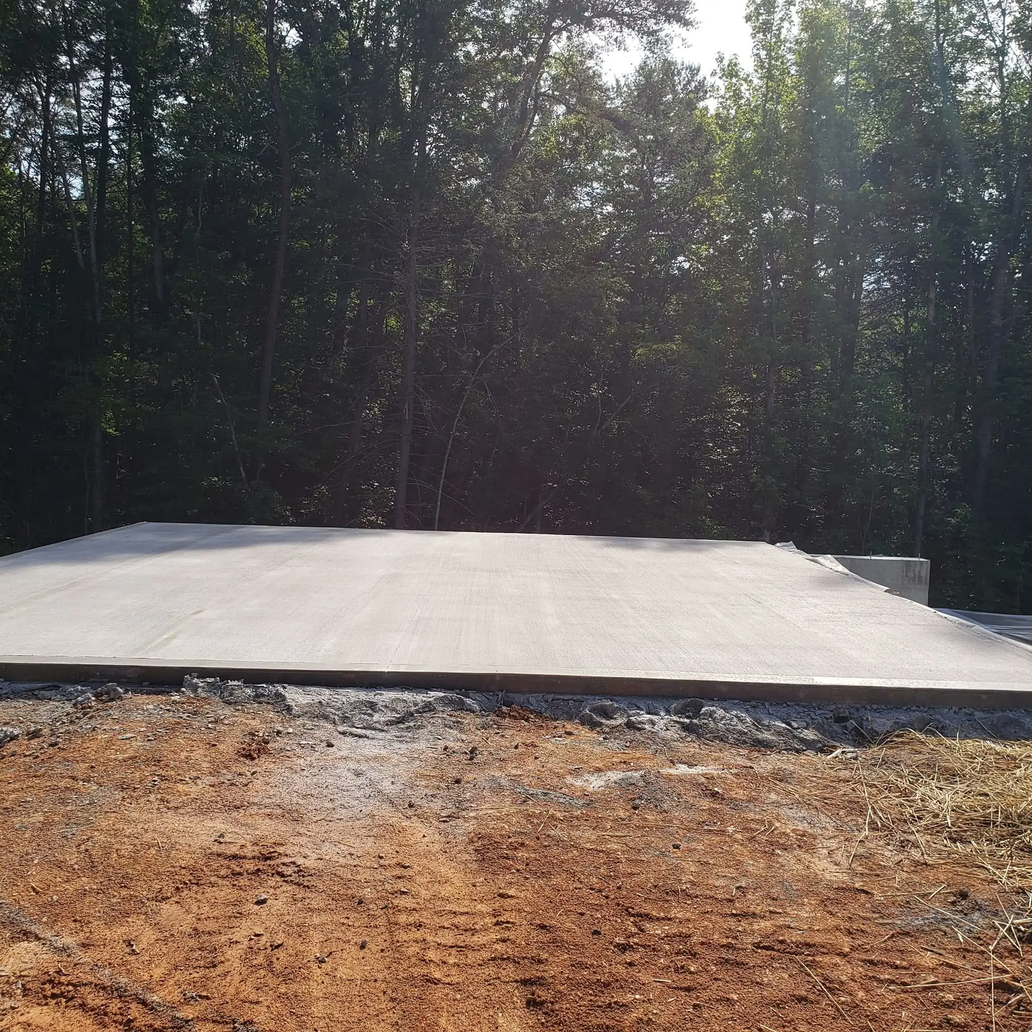 Fresh concrete slab poured on a cleared lot near Knoxville, Tennessee