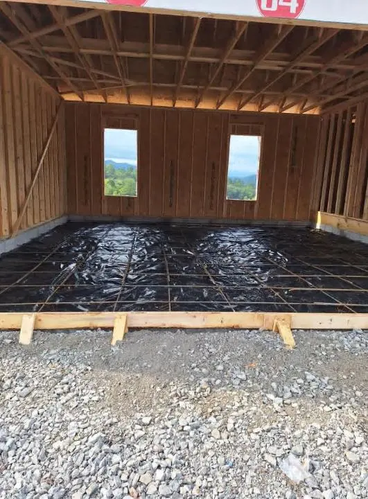Concrete slab poured inside new framing in Knoxville, Tennessee