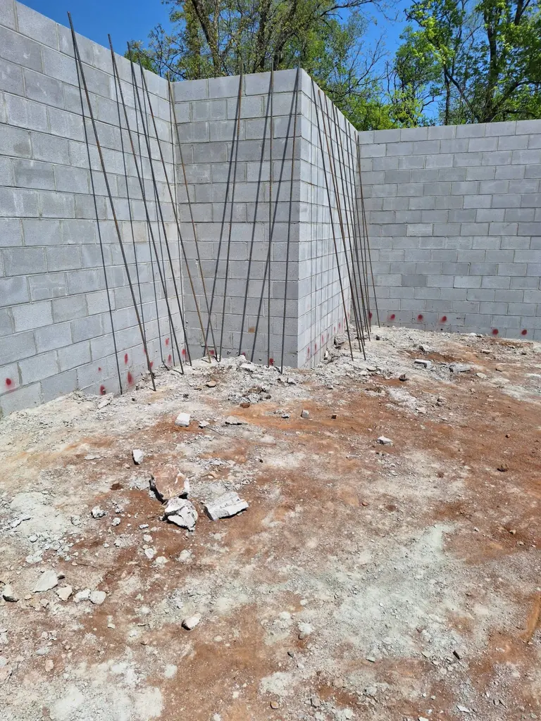 Tall block foundation walls around a finished slab in Knoxville, Tennessee