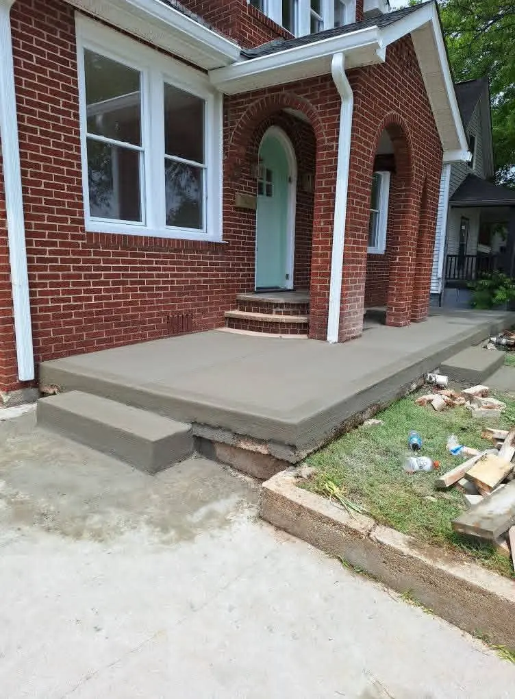 New concrete porch and steps at a brick home in Knoxville, Tennessee