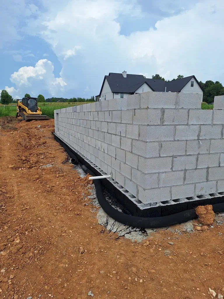 Block retaining wall going up on its footing in Knoxville, Tennessee